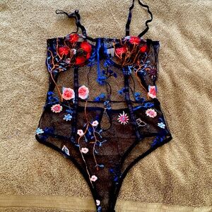 Black sheer bodysuit with flower design